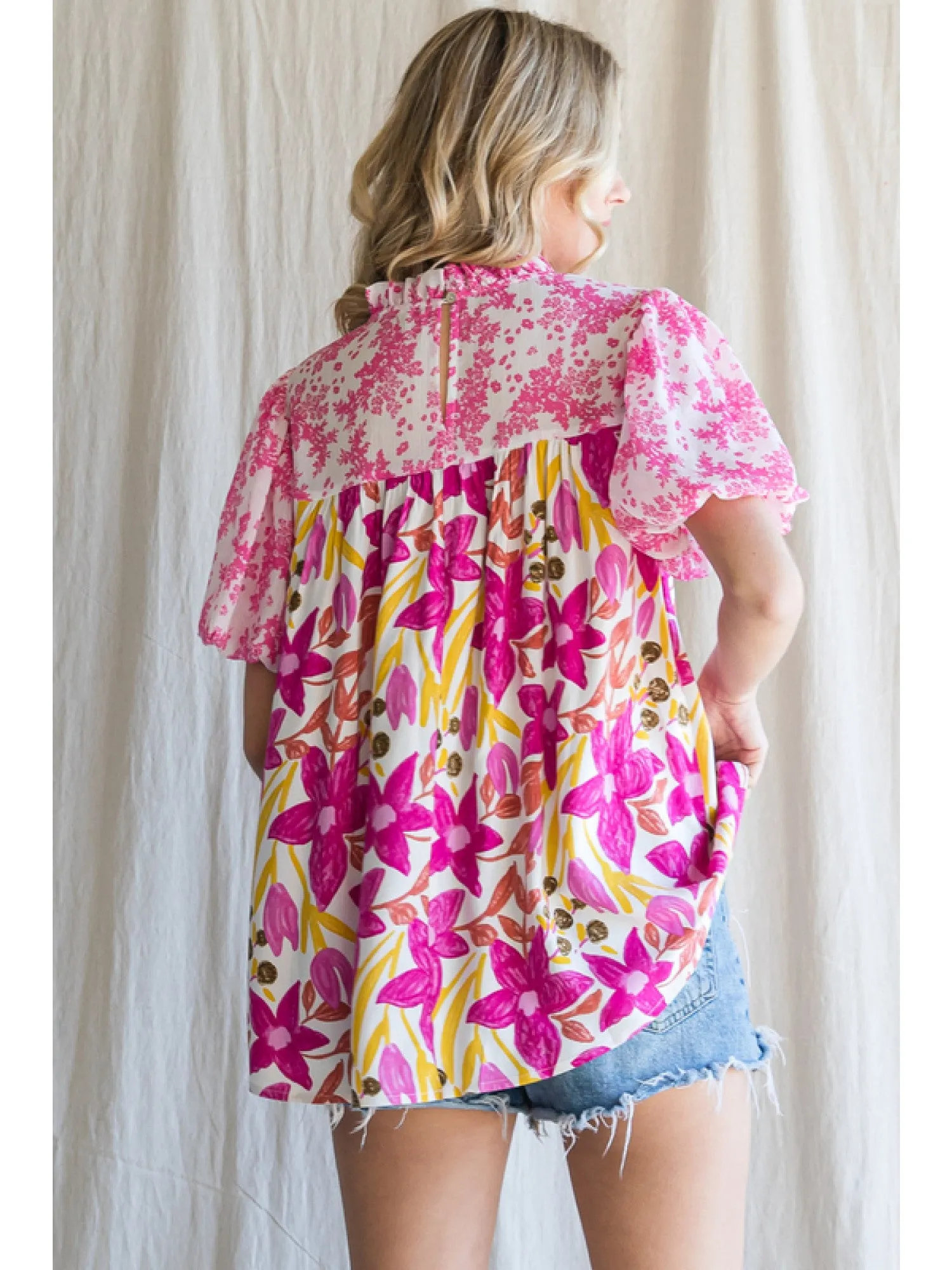 Floral print top with a frill mock neckline