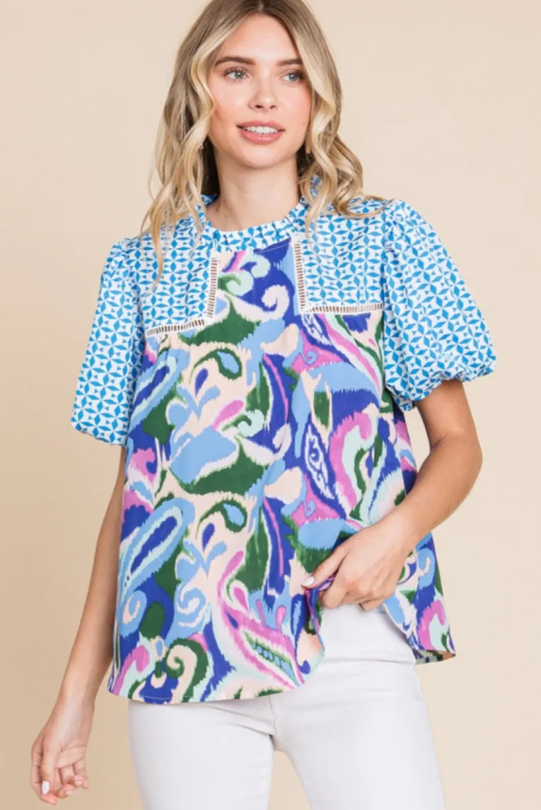 Floral print top with a frill mock neckline