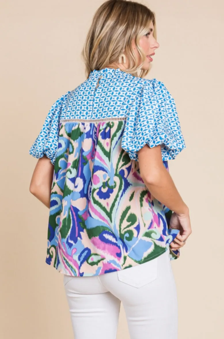 Floral print top with a frill mock neckline