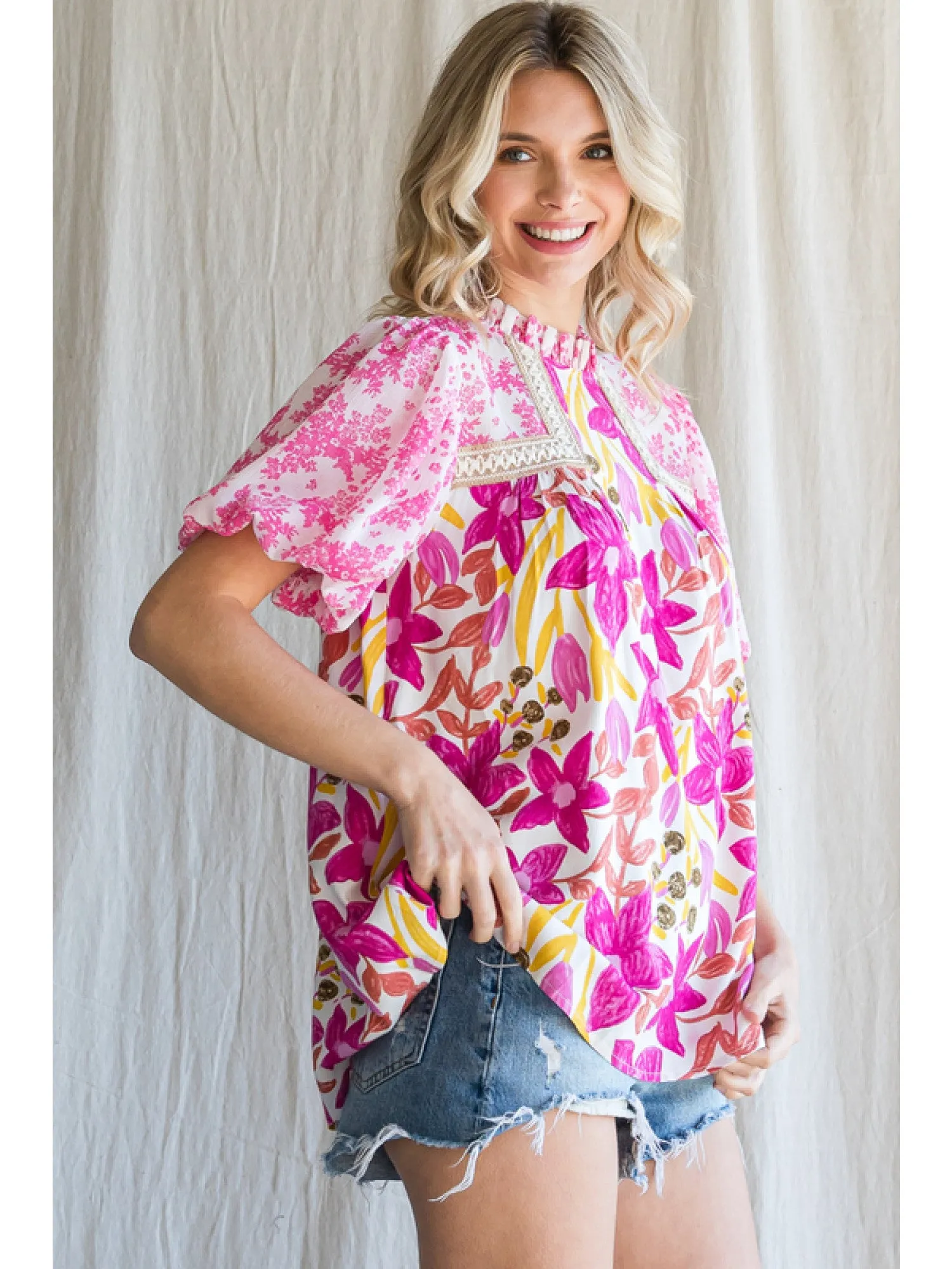 Floral print top with a frill mock neckline