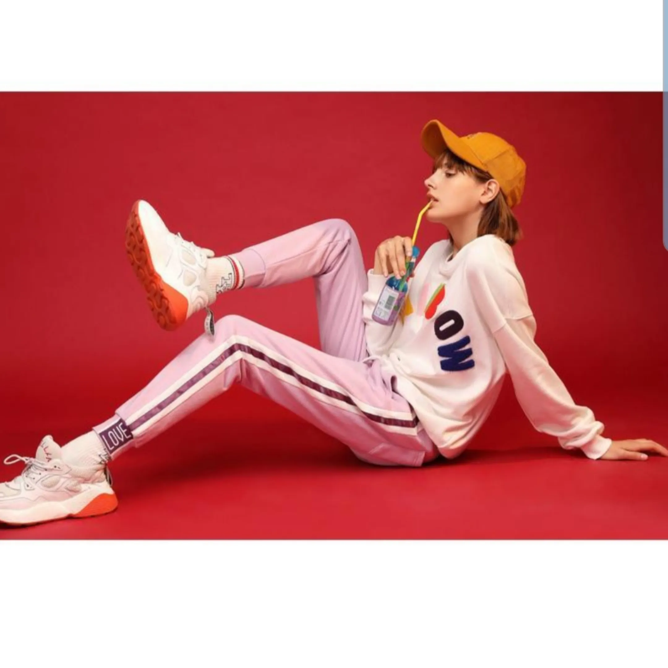 Light purple trackpants with white stripes