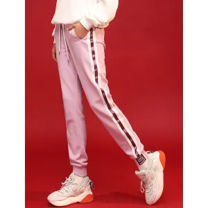 Light purple trackpants with white stripes