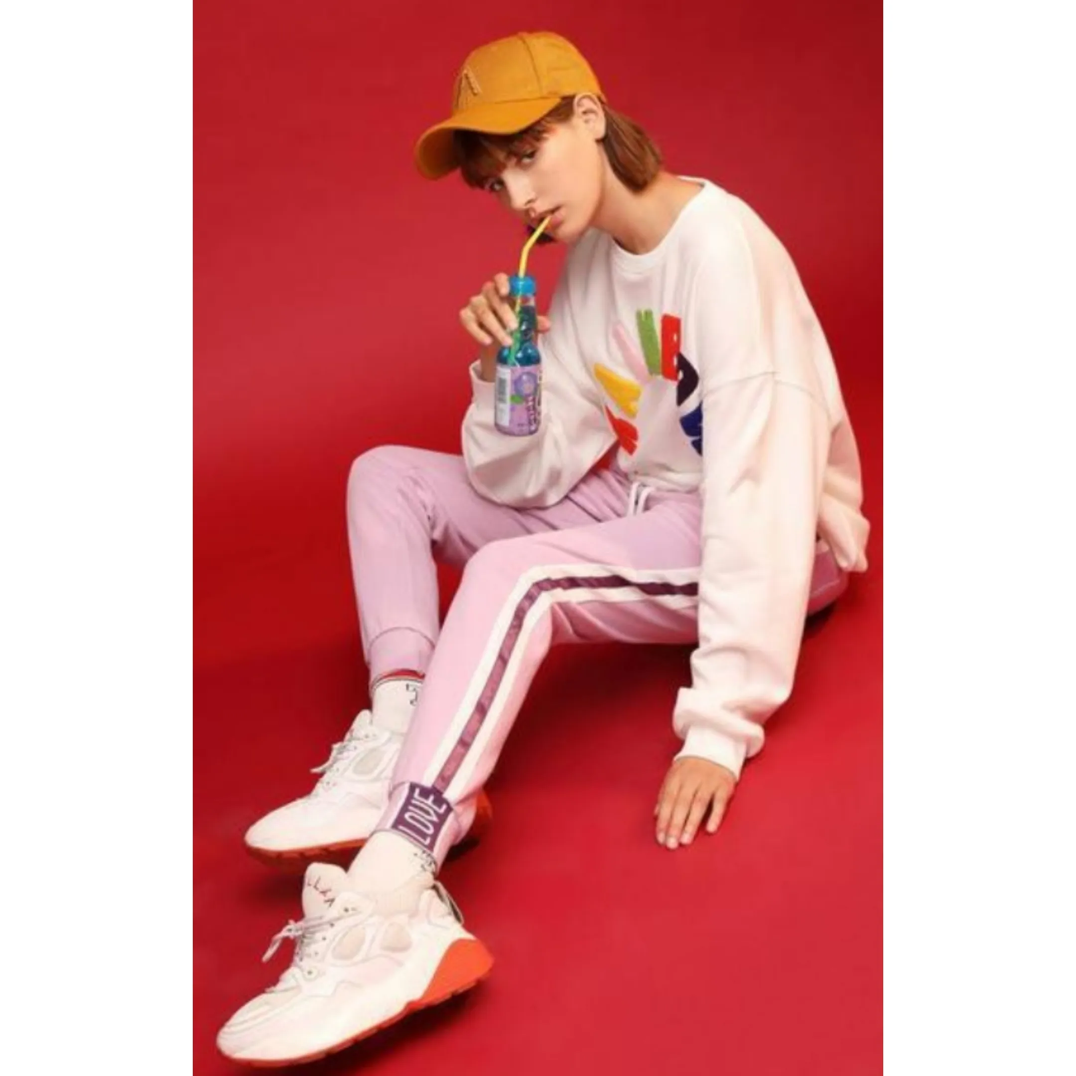 Light purple trackpants with white stripes