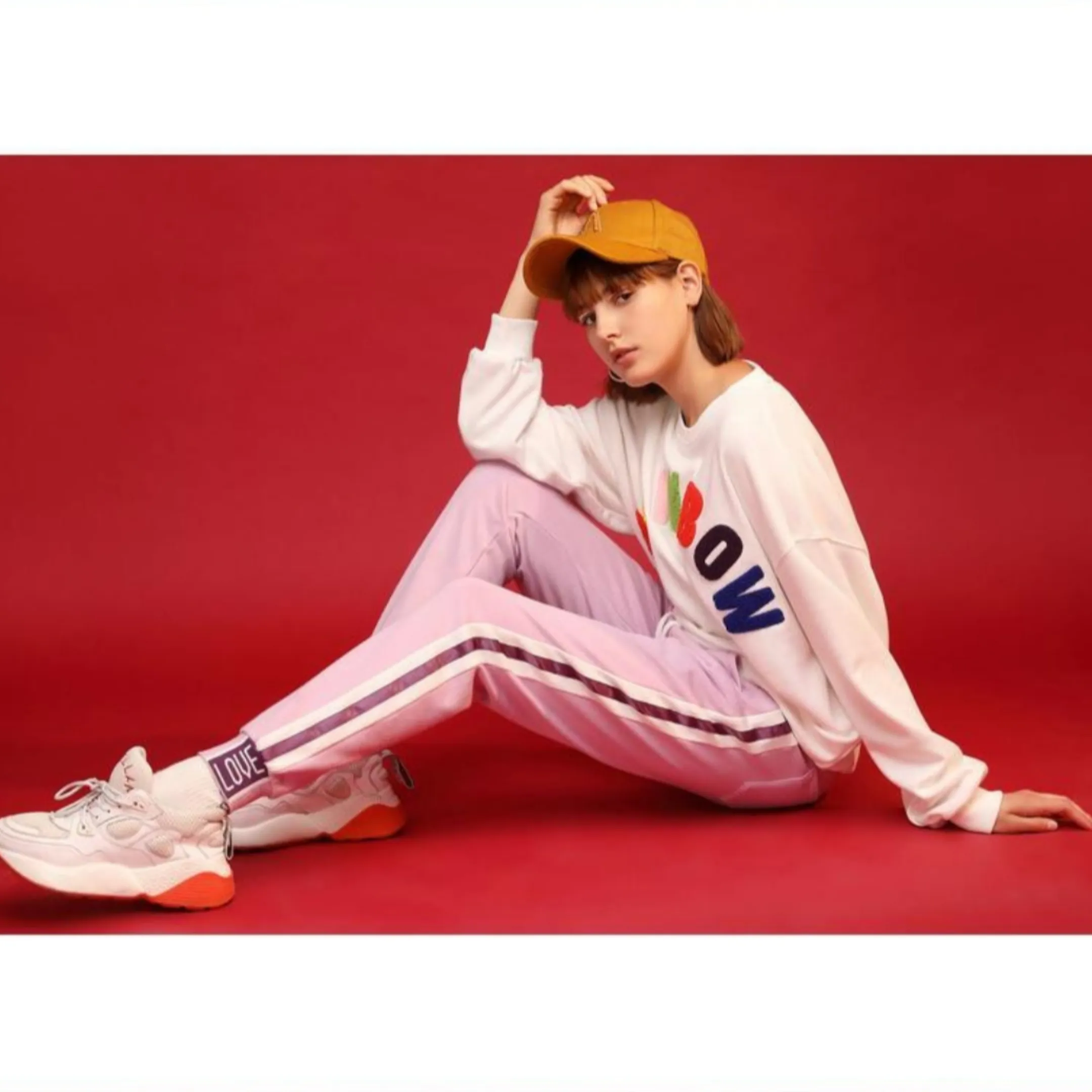 Light purple trackpants with white stripes