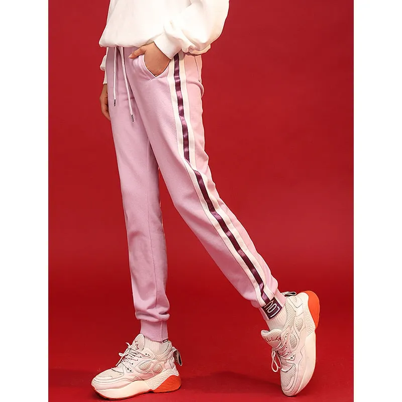 Light purple trackpants with white stripes