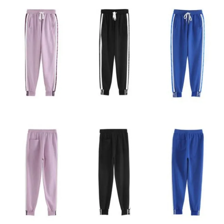 Light purple trackpants with white stripes