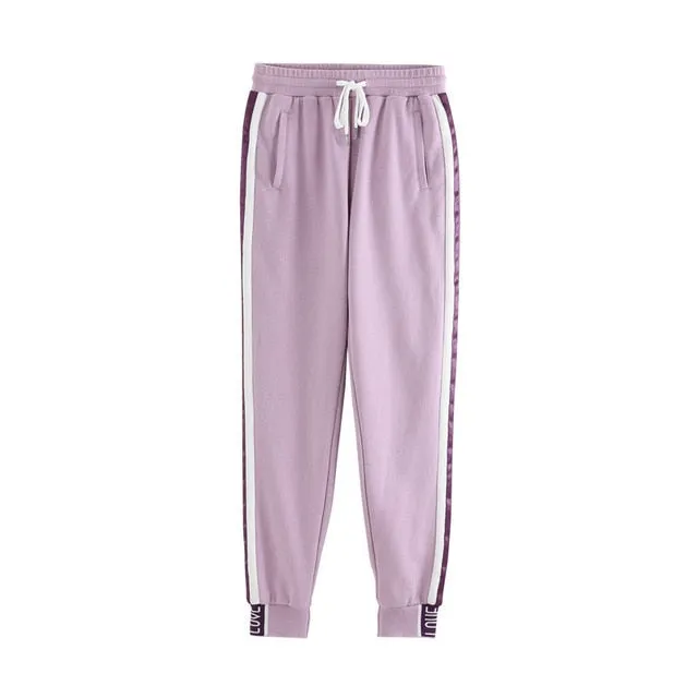 Light purple trackpants with white stripes