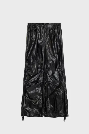 Oversized black parachute metallic pants